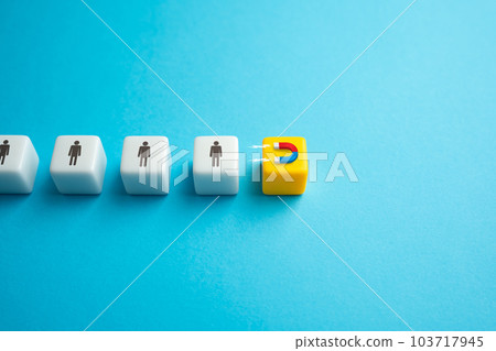 Attracting people with a magnet. Draw people. Grab attention. Influence engaging audiences. Hiring new job candidates. Marketing and advertising. 103717945