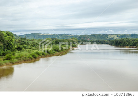 River with lush green  banks 103718663