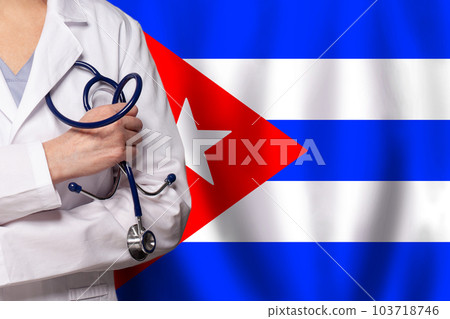 Cuban medicine and healthcare concept. Doctor close up against flag of Cuba background Cuban medicine and healthcare concept. Doctor close up against flag of Cuba background 103718746