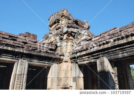 Ruins of ancient Khmer stone buildings against a clear blue sky. Ruins of ancient Khmer stone buildings against a clear blue sky. 103719397