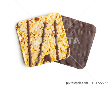 Puffed corn crackers chocolate covered isolated on white background. Puffed corn crackers chocolate covered isolated on white background. 103722236