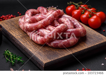 Raw sausages from pork or beef with salt, spices and herbs 103723466