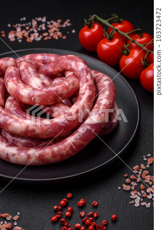 Raw sausages from pork or beef with salt, spices and herbs 103723472