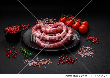 Raw sausages from pork or beef with salt, spices and herbs 103723474