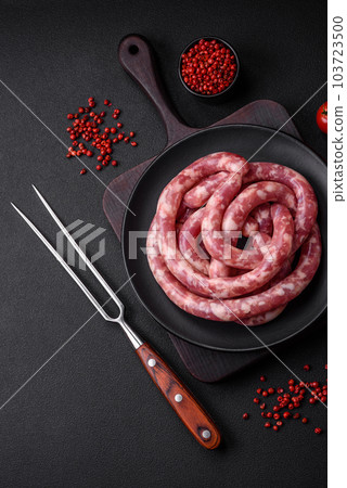 Raw sausages from pork or beef with salt, spices and herbs 103723500