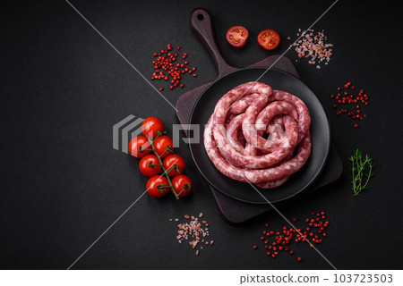 Raw sausages from pork or beef with salt, spices and herbs 103723503