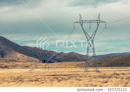 Photograph of transmission towers and lines running through a valley in New Zealand Photograph of transmission towers and lines running through a valley in New Zealand 103725222