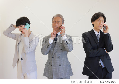 Three business people who receive troublesome calls_2 Three business people who receive troublesome calls_2 103725300