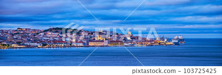 View of Lisbon over Tagus river with passing ferry boat from Almada with moored cruise liner in evening twilight. Lisbon, Portugal View of Lisbon over Tagus river with passing ferry boat from Almada with moored cruise liner in evening twilight. Lisbon, Portugal 103725425