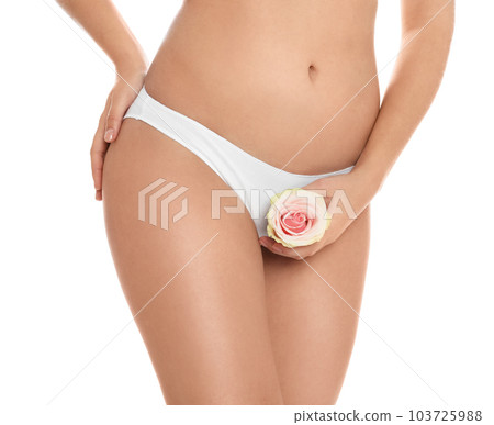 Woman with rose showing smooth skin on white background, closeup. Brazilian bikini epilation 103725988