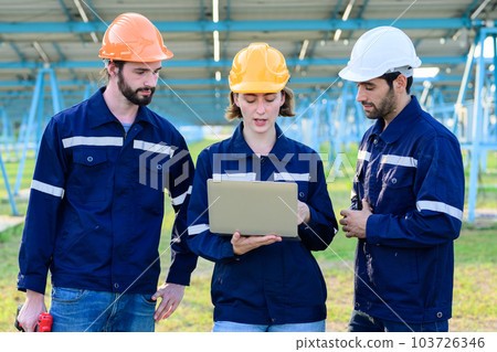 Workers installing solar panels, Engineer team at solar panel farm Workers installing solar panels, Engineer team at solar panel farm 103726346