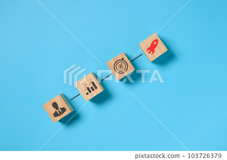 Business icons on wooden cube, New start up business project 103726379