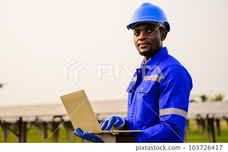 Maintenance engineer installing solar panels on solar cell farm Maintenance engineer installing solar panels on solar cell farm 103726417