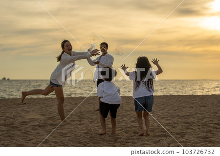 Happy Asian family travel on beach on holiday 103726732