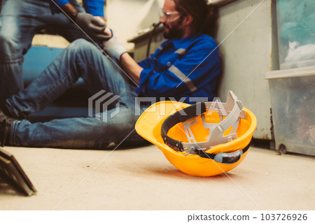 Hardworking engineer worker with accident at factory Hardworking engineer worker with accident at factory 103726926
