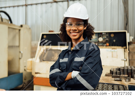 Smiling portrait of confident engineer worker at factory 103727102