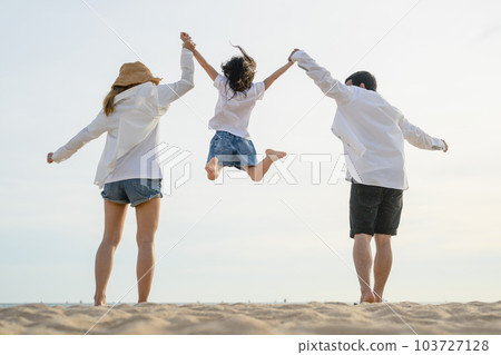 Happy family enjoying together on beach on holiday vacation Happy family enjoying together on beach on holiday vacation 103727128