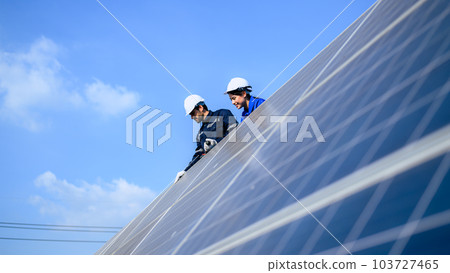 Solar panel station, Engineer installing solar panel at solar energy farm field Solar panel station, Engineer installing solar panel at solar energy farm field 103727465
