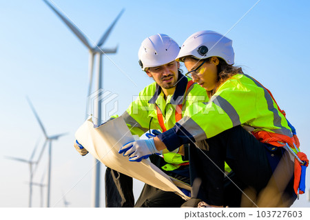 Renewable energy engineer working on wind turbine 103727603