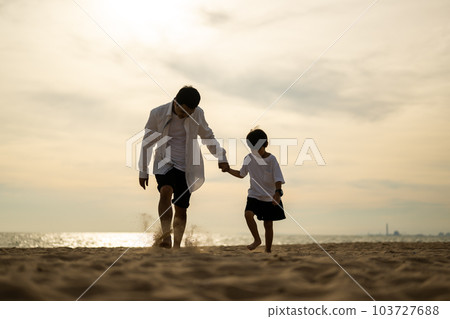Happy Asian family travel on beach on holiday Happy Asian family travel on beach on holiday 103727688
