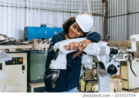 Engineer technician controlling robotic arms on computer laptop 103727754