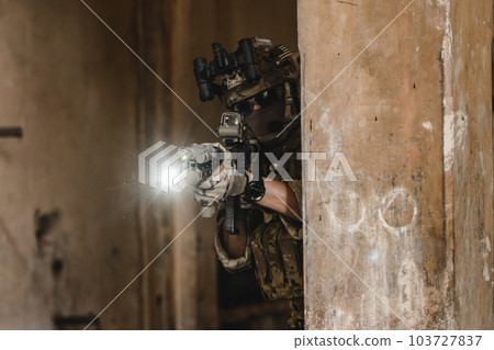 Expert team of soldiers with weapons attacking enemy 103727837