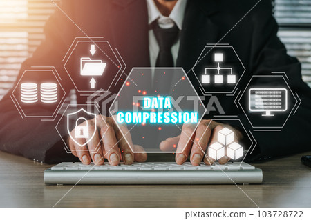 Data compression concept, Person hand typing keyboard computer on desk with data compression icon on virtual screen. Data compression concept, Person hand typing keyboard computer on desk with data compression icon on virtual screen. 103728722