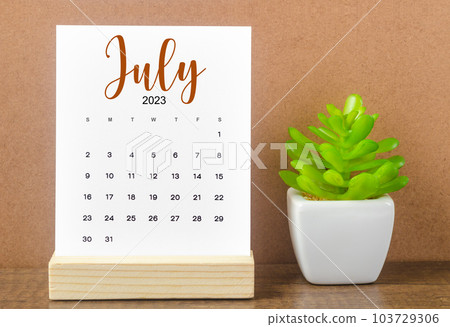 The July 2023 Monthly calendar for 2023 year on wooden table. 103729306