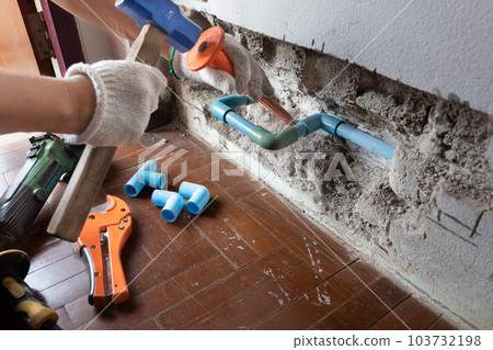 Plumber must open a wall to access a broken pipe. 103732198