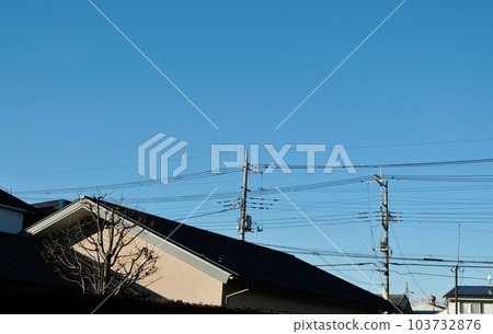 Various cables and wires and utility poles that support them Various cables and wires and utility poles that support them 103732876