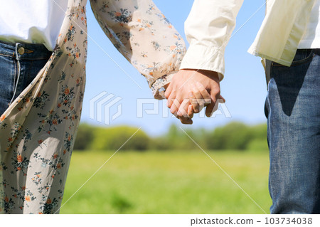 Hand photo of men and women holding hands 103734038