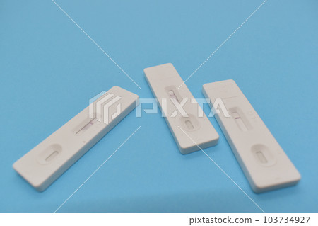 covid test kit on blue background covid test kit on blue background 103734927