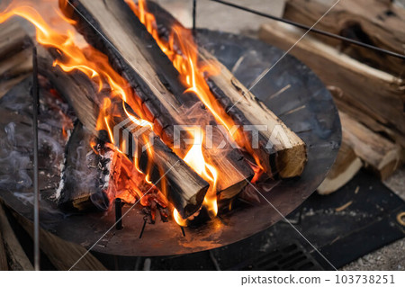 camping bonfire flame camping gear firewood bonfire stand campfire sandy beach 103738251