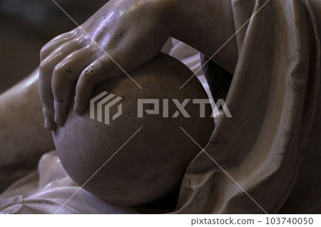 Close up detail of medieval or renaissance marble sculpture in a cathedral showing a hand on a round sphere. High quality photo Close up detail of medieval or renaissance marble sculpture in a cathedral showing a hand on a round sphere. High quality photo 103740050