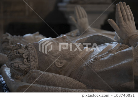 Sarcophagi of Catherine De Medici and Henry II. Stone carved statues of royalty with fine details in clothing, crowns. Focus on foreground 103740051