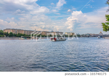 Cruise ship sails on the Moscow river in Moscow city center, popular place for walking. Cruise ship sails on the Moscow river in Moscow city center, popular place for walking. 103740173