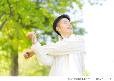 Photo of a man stretching Photo of a man stretching 103740903
