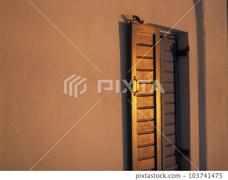 Evening light illuminating the white walls and windows 103741475