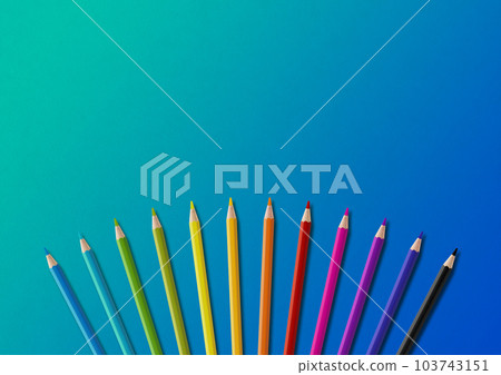Colored pencil group isolated on blue. Horizontal background 103743151