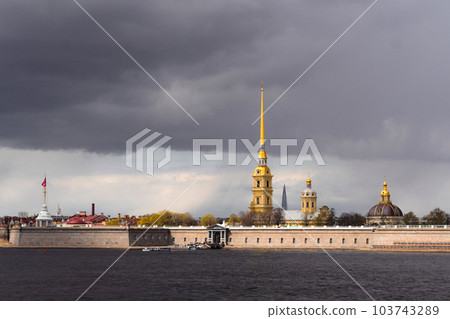 peter and paul fortress in Saint petersburg, Russia. View of Zayachy island and Neva river. Cloudy sky on background 103743289