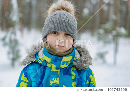 winter portrait of cute caucasian boy on sunny day winter portrait of cute caucasian boy on sunny day 103743296