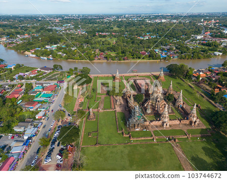 Aerial view evening sunset at Wat Chaiwatthanaram green grass park famous ruin temple 103744672