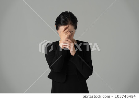 Woman in mourning thinking crying Woman in mourning thinking crying 103746484