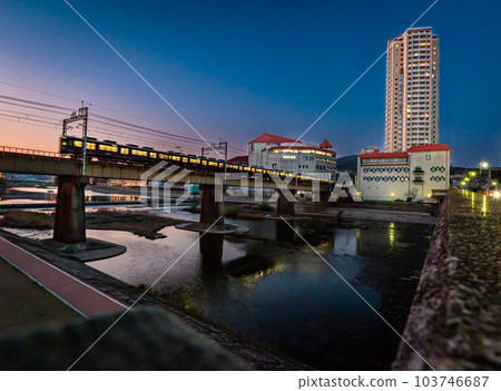 Muko River flowing through Takarazuka city, evening view from Ohashi Bridge, March 31, Japan 103746687