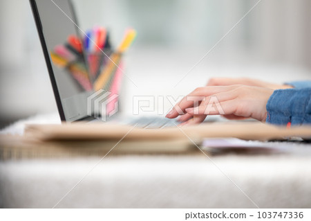 Close up hand of business woman typing on keyboard working with computer laptop. Hands of woman chatting or writing article on work table at home. B roll typing to communication on computer Close up hand of business woman typing on keyboard working with computer laptop. Hands of woman chatting or writing article on work table at home. B roll typing to communication on computer 103747336