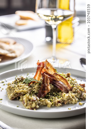 Pistachio and pancetta freshly made creamy Italian risotto 103748539