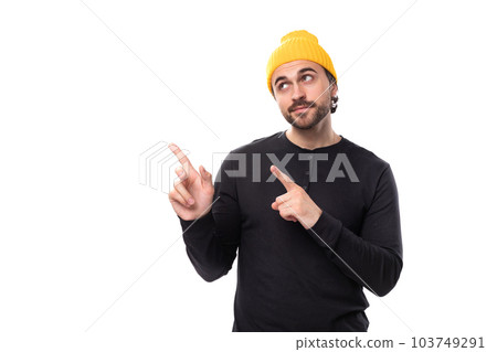 brutal 30s authentic brunet male adult in black sweatshirt pointing finger at new strategy on white brutal 30s authentic brunet male adult in black sweatshirt pointing finger at new strategy on white 103749291