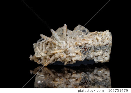 Macro mineral stone fluorite with quartz against black background 103751479