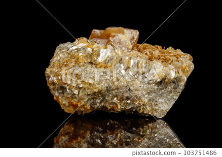 Macro Mineral Stone Sheelit on a black background Macro Mineral Stone Sheelit on a black background 103751486