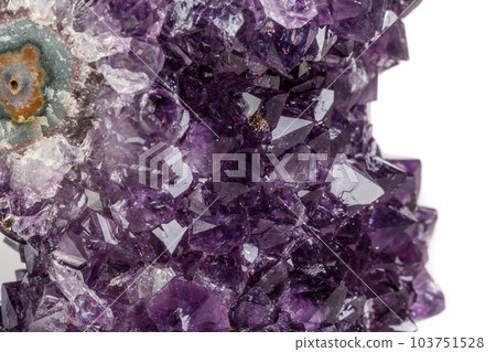 Macro mineral stone Amethyst eye, in the form of an owl on a white background 103751528